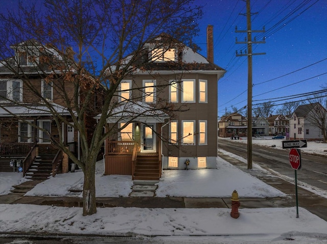 traditional style home featuring a residential view and stairs