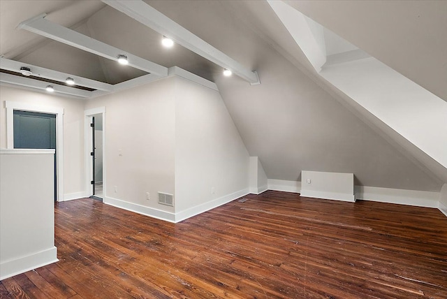 bonus room featuring lofted ceiling with beams, visible vents, baseboards, and dark wood-style flooring