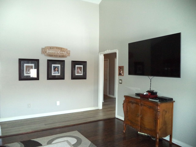 living room with dark hardwood / wood-style flooring