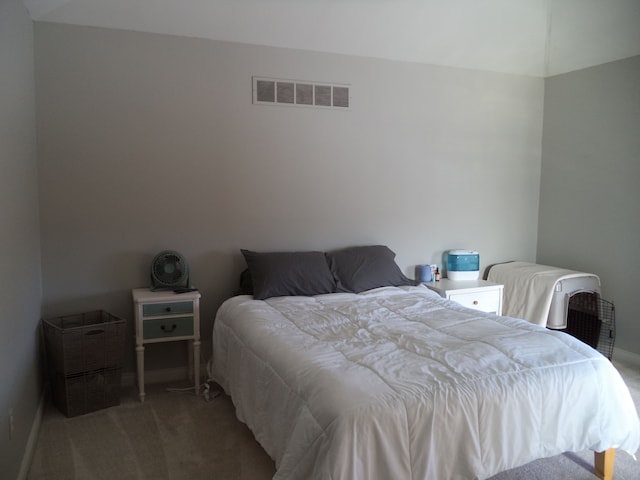 bedroom featuring light carpet and visible vents