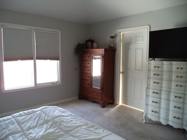 unfurnished bedroom featuring light carpet