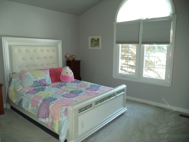 bedroom featuring multiple windows and light carpet