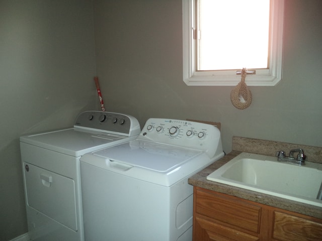 laundry area with sink and washer and dryer