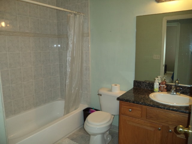 full bathroom featuring toilet, tile patterned flooring, shower / bath combination with curtain, and vanity