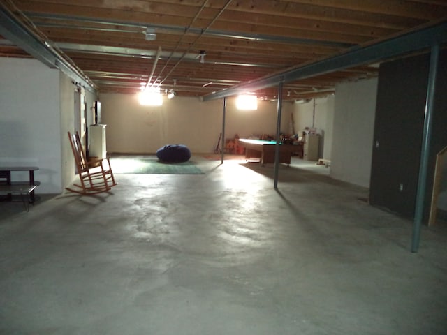 basement with billiards and water heater