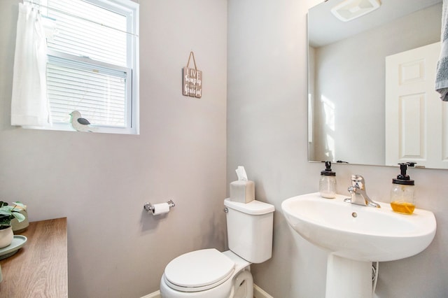 bathroom with toilet and sink