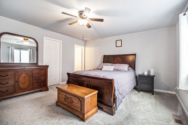 bedroom with light carpet and ceiling fan