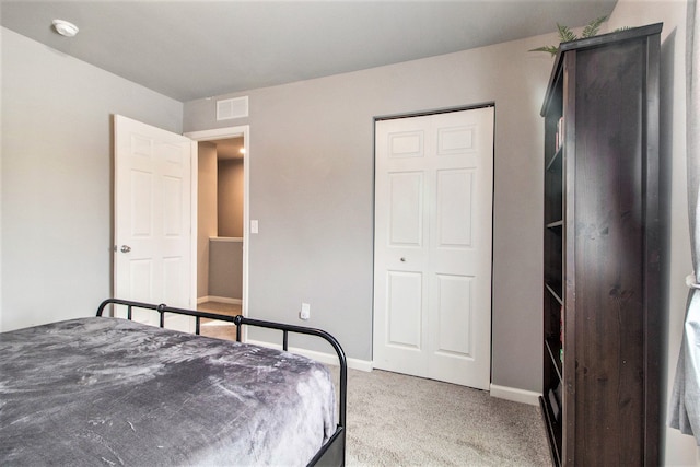 bedroom featuring light colored carpet