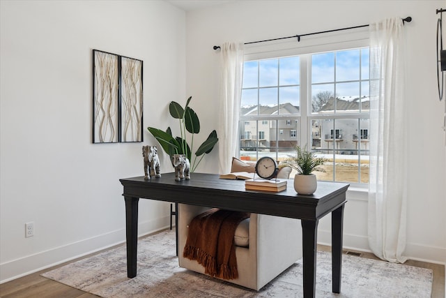 office space with light hardwood / wood-style floors