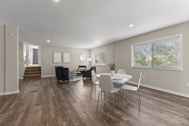 dining space featuring dark hardwood / wood-style flooring