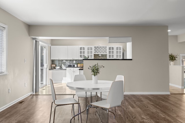 dining area featuring hardwood / wood-style floors