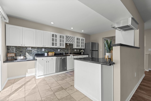 kitchen with backsplash, white cabinetry, appliances with stainless steel finishes, light tile patterned flooring, and sink