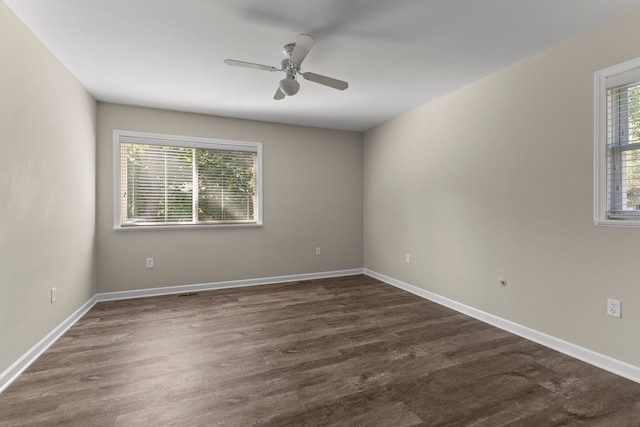 spare room featuring ceiling fan and a wealth of natural light