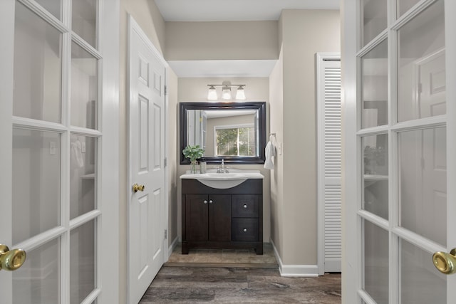 bathroom with vanity and wood-type flooring