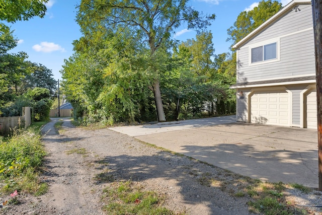 view of yard featuring a garage