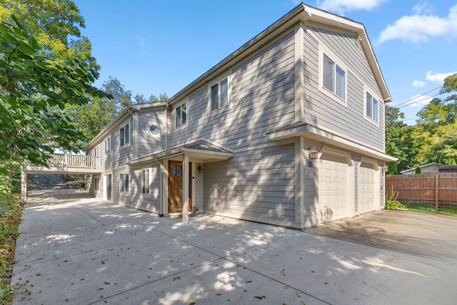 rear view of property with a garage