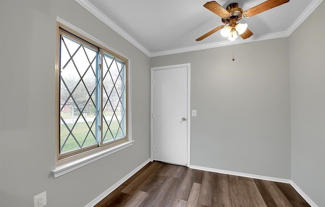 unfurnished room with ceiling fan, dark wood-type flooring, and ornamental molding