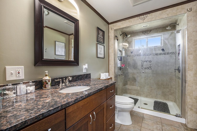 bathroom with tile patterned flooring, ornamental molding, toilet, walk in shower, and vanity