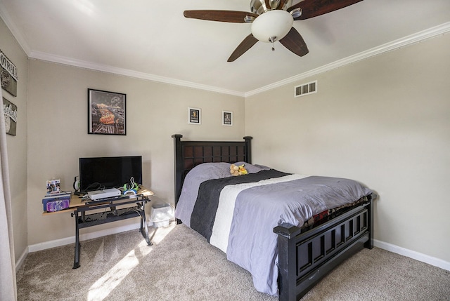 carpeted bedroom with ceiling fan and crown molding