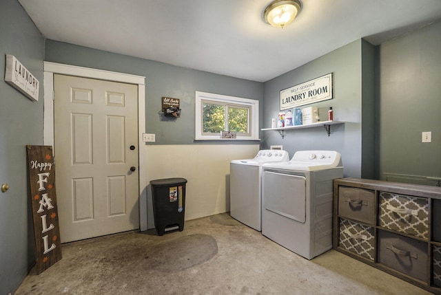 clothes washing area featuring separate washer and dryer