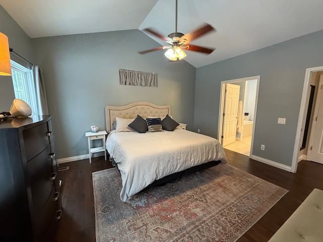 bedroom with ceiling fan, lofted ceiling, dark hardwood / wood-style flooring, and ensuite bath