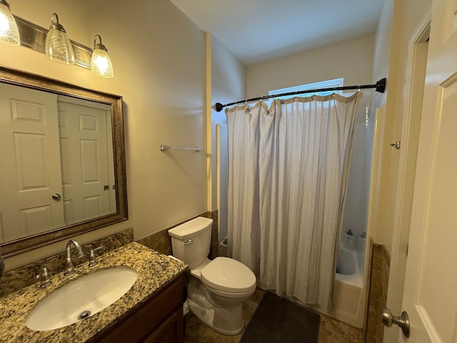 full bathroom with toilet, vanity, and shower / tub combo with curtain