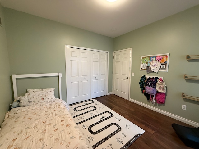 bedroom featuring a closet and dark hardwood / wood-style flooring