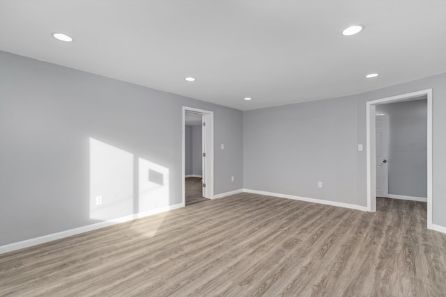 unfurnished room with light hardwood / wood-style floors