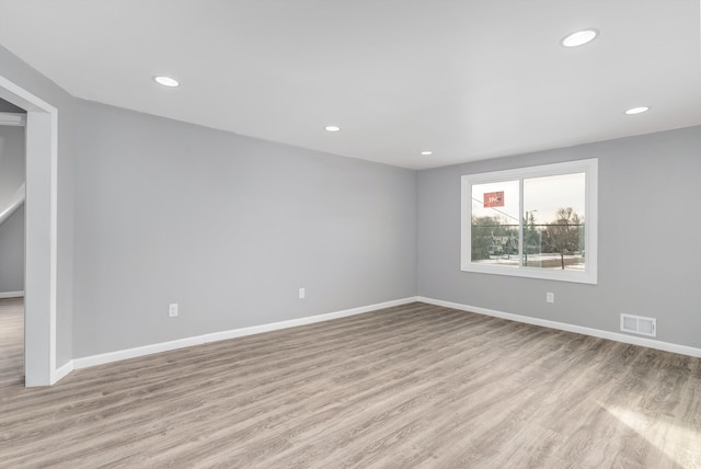 unfurnished room featuring light wood-type flooring