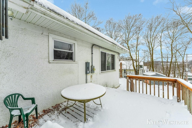 view of snow covered deck