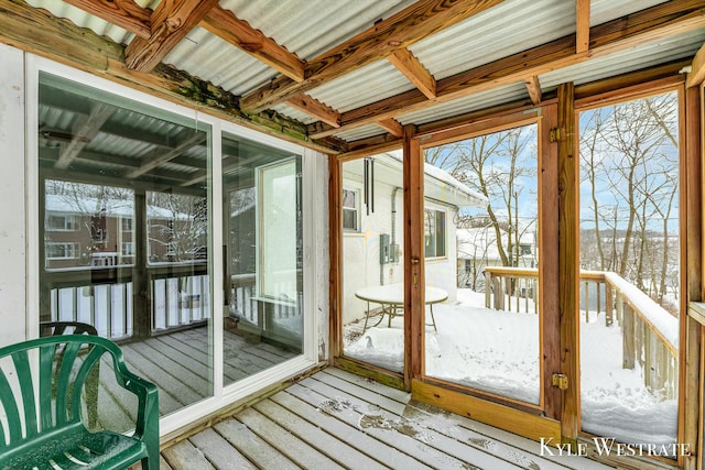 unfurnished sunroom with a wealth of natural light