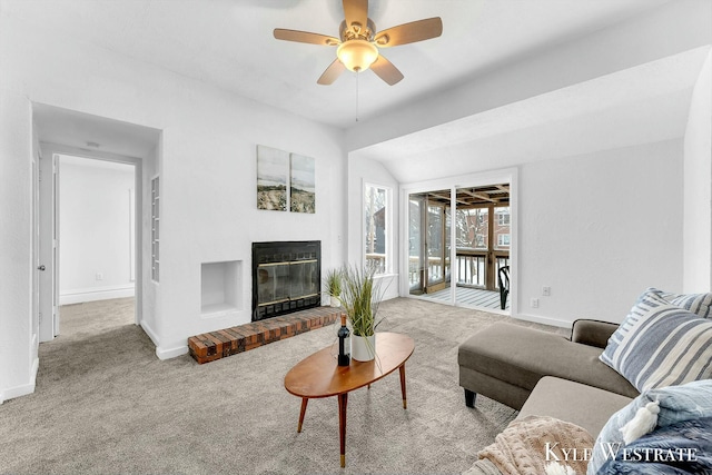 carpeted living room with lofted ceiling and ceiling fan