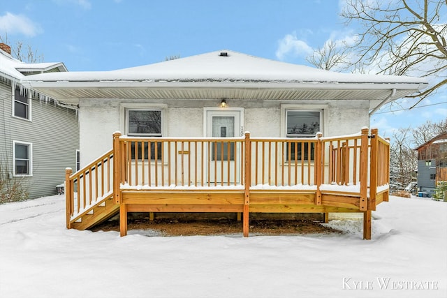 view of snow covered house