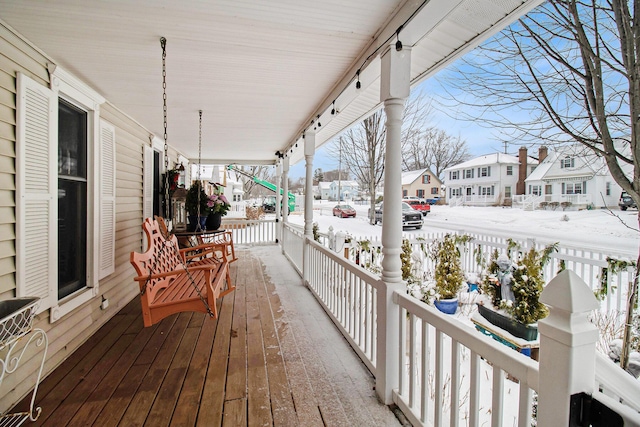 view of snow covered deck