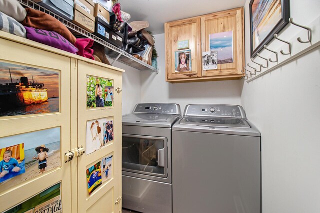 laundry room featuring washing machine and clothes dryer