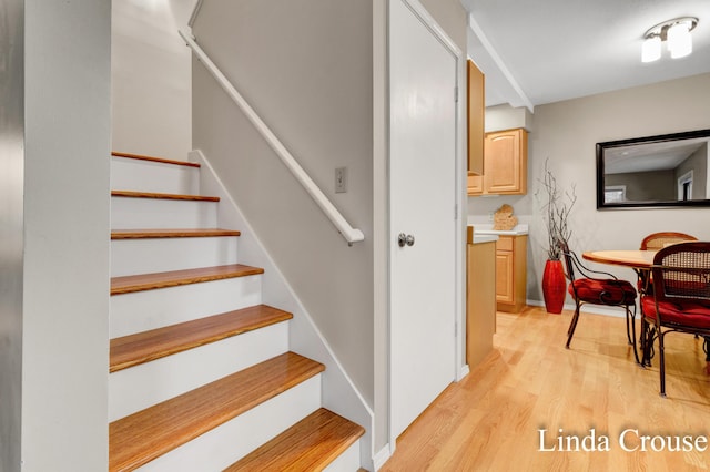 stairway featuring hardwood / wood-style flooring