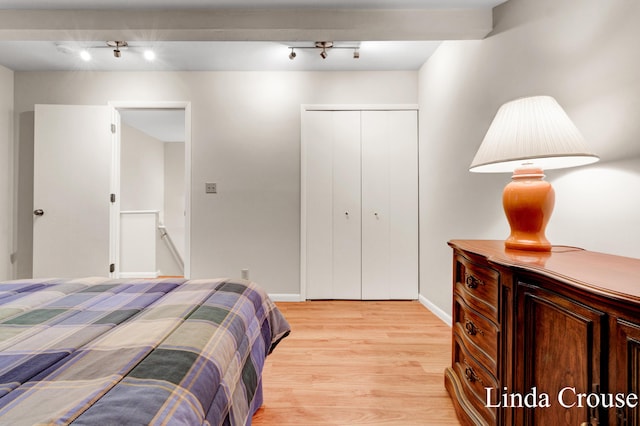 bedroom featuring a closet and light hardwood / wood-style flooring