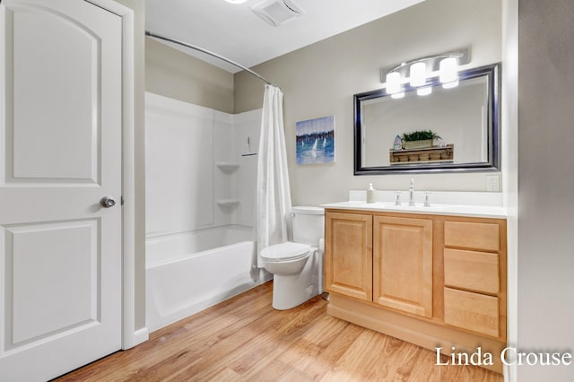 full bathroom with toilet, vanity, shower / bath combination with curtain, and hardwood / wood-style flooring