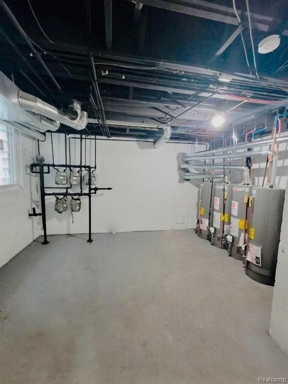 basement featuring secured water heater and water heater