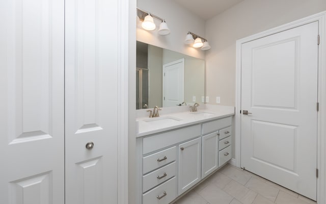 bathroom with tile patterned flooring and vanity