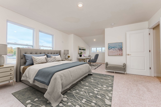 bedroom featuring carpet floors and vaulted ceiling