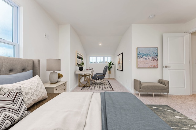 carpeted bedroom with vaulted ceiling