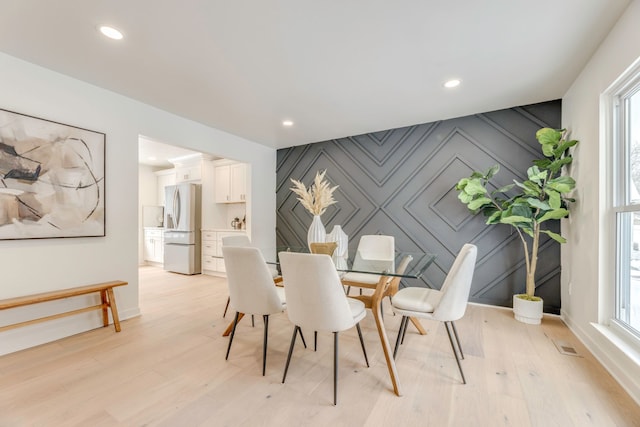 dining room featuring light hardwood / wood-style flooring