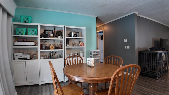 dining room with ornamental molding, dark hardwood / wood-style flooring, and a textured ceiling