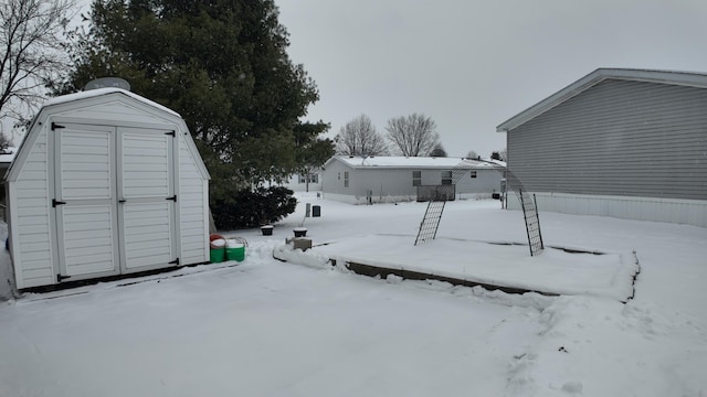 view of yard covered in snow