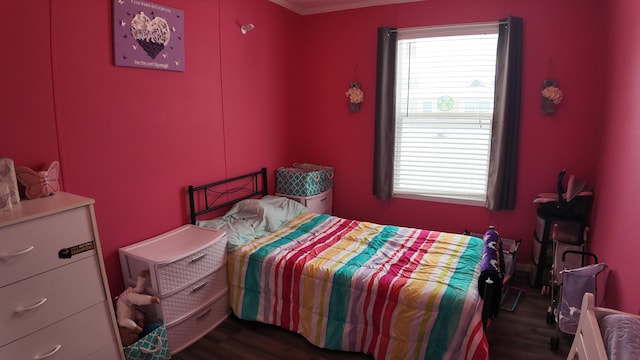 bedroom with dark wood-type flooring