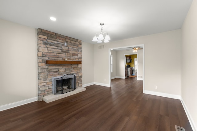 unfurnished living room with baseboards, a fireplace, wood finished floors, and visible vents