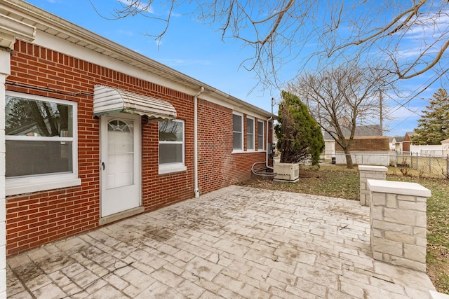 view of patio / terrace featuring fence