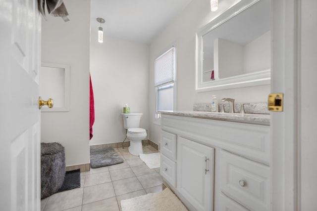 bathroom with tile patterned floors, vanity, and toilet