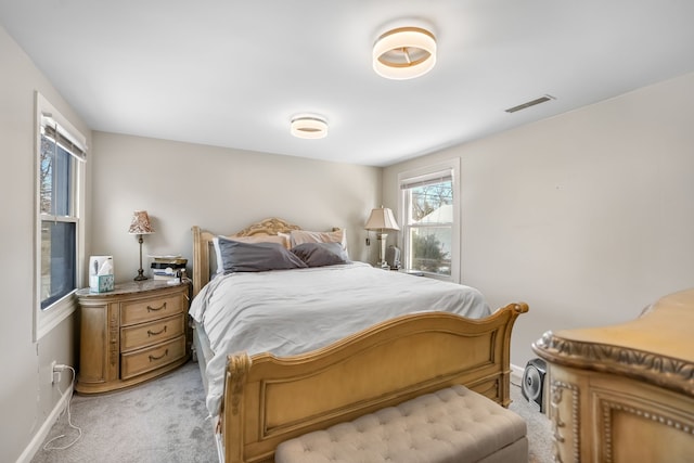 bedroom featuring light carpet